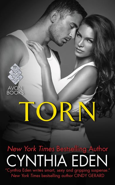 Torn: A Forensic Anthropologist Becomes a Killer's Target―And a Dangerous Agent Must Protect the Woman He Loves (LOST Series, 4) by Cynthia Eden - Mass Market Paperback cover