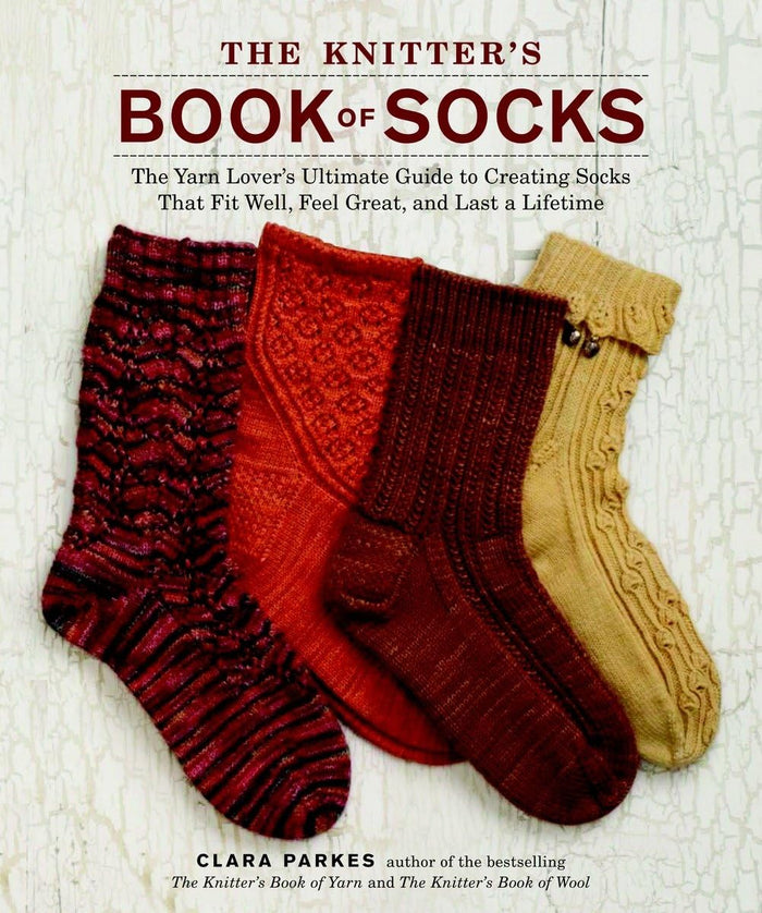 The Knitter's Book of Socks: The Yarn Lover's Ultimate Guide to Creating Socks That Fit Well, Feel Great, and Last a Lifetime by Clara Parkes - Hardcover cover