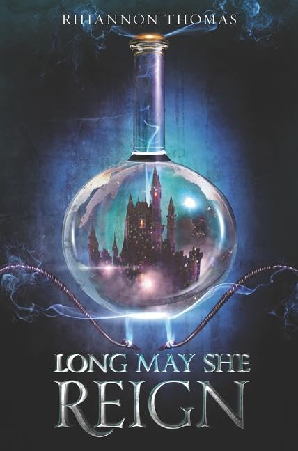 Long May She Reign: A Thrilling YA Fantasy Standalone About a Scientist Queen and Deadly Court Intrigue by Rhiannon Thomas - Hardcover cover