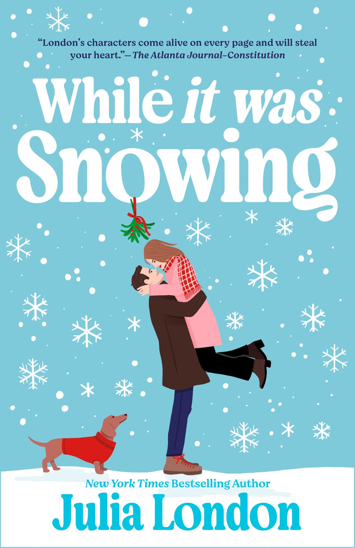 While It Was Snowing by Julia London - Paperback cover